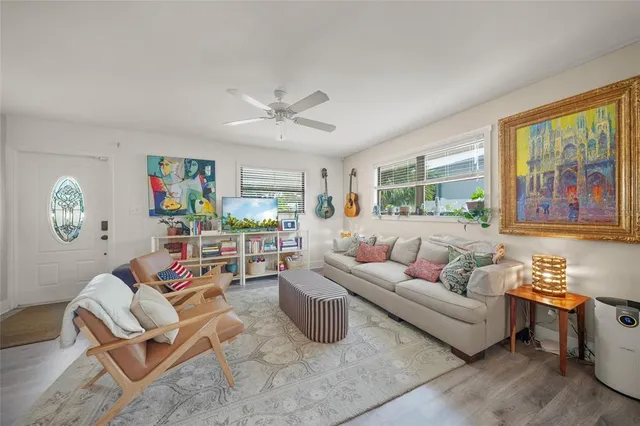 a living room with fireplace furniture and a window