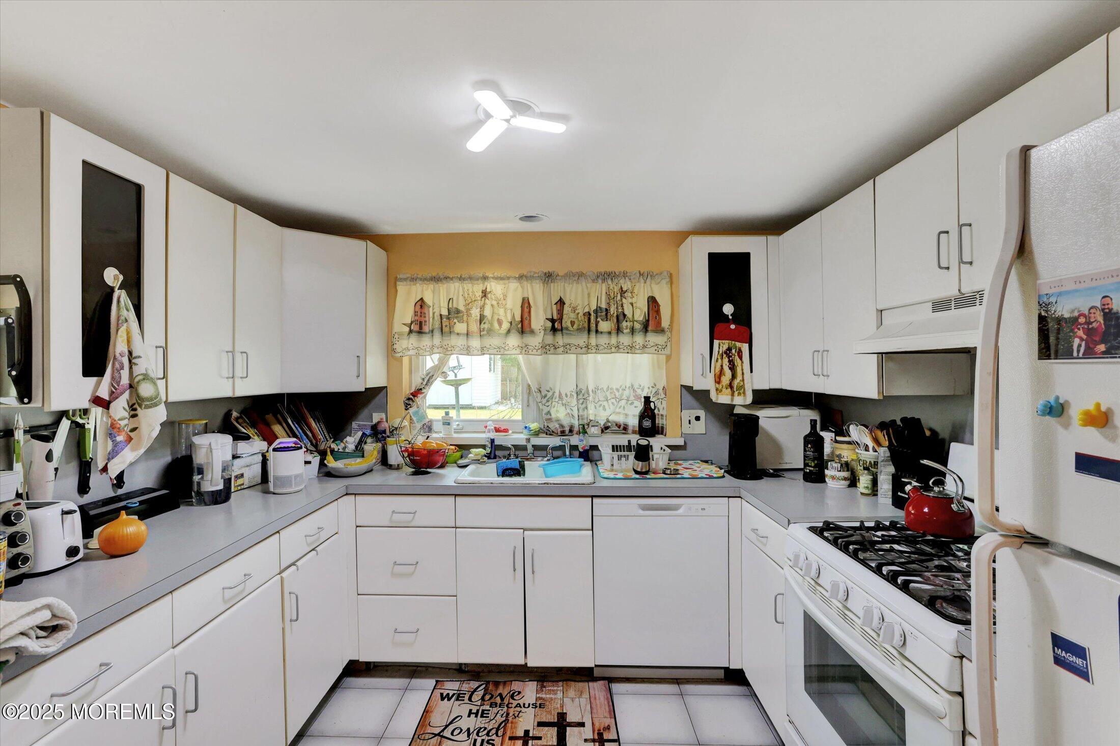 12 Steven Place Jackson, NJ 08527 - Photo 11 of 31 a kitchen with stainless steel appliances a sink stove and cabinets