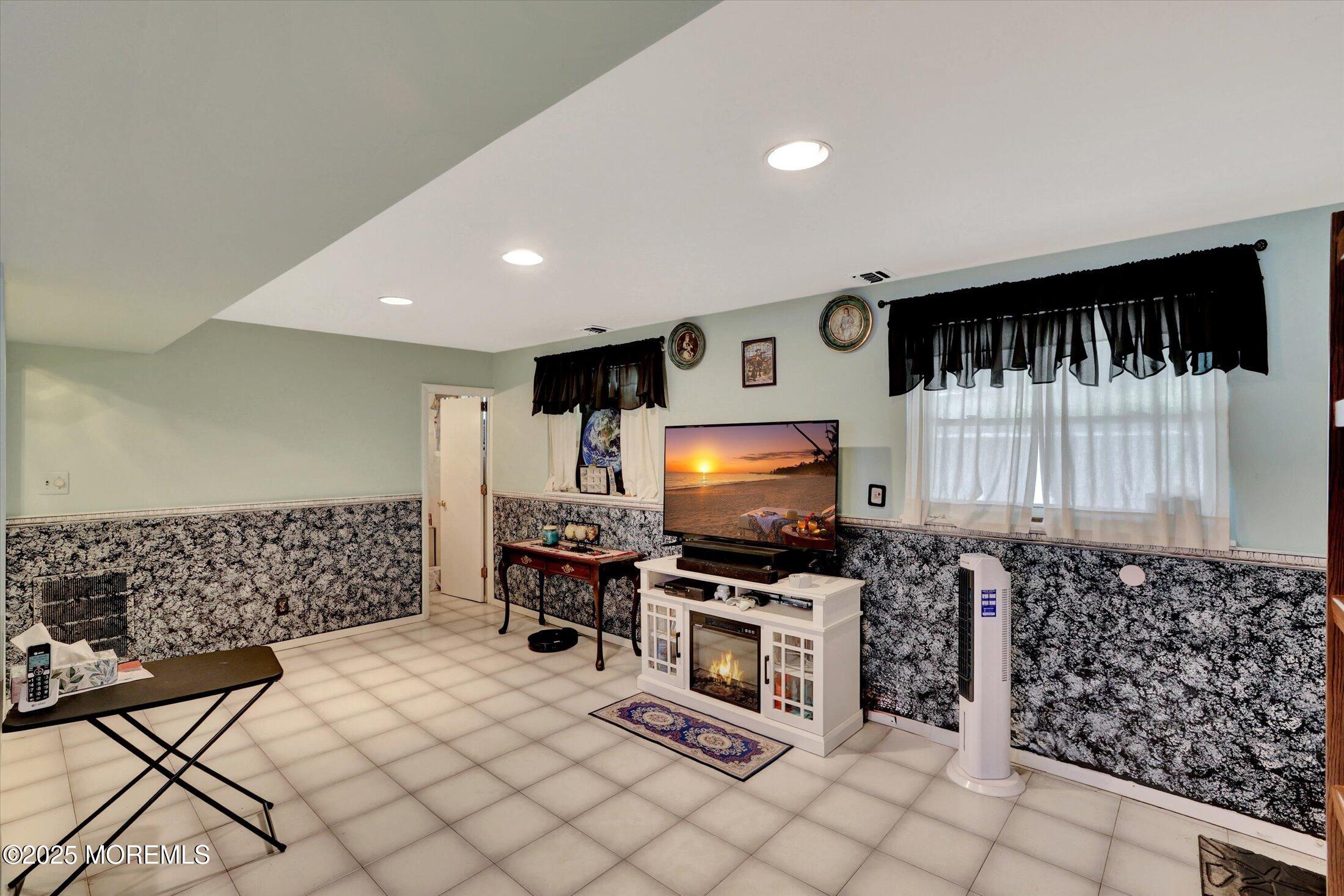 12 Steven Place Jackson, NJ 08527 - Photo 13 of 31 a living room with furniture and a flat screen tv