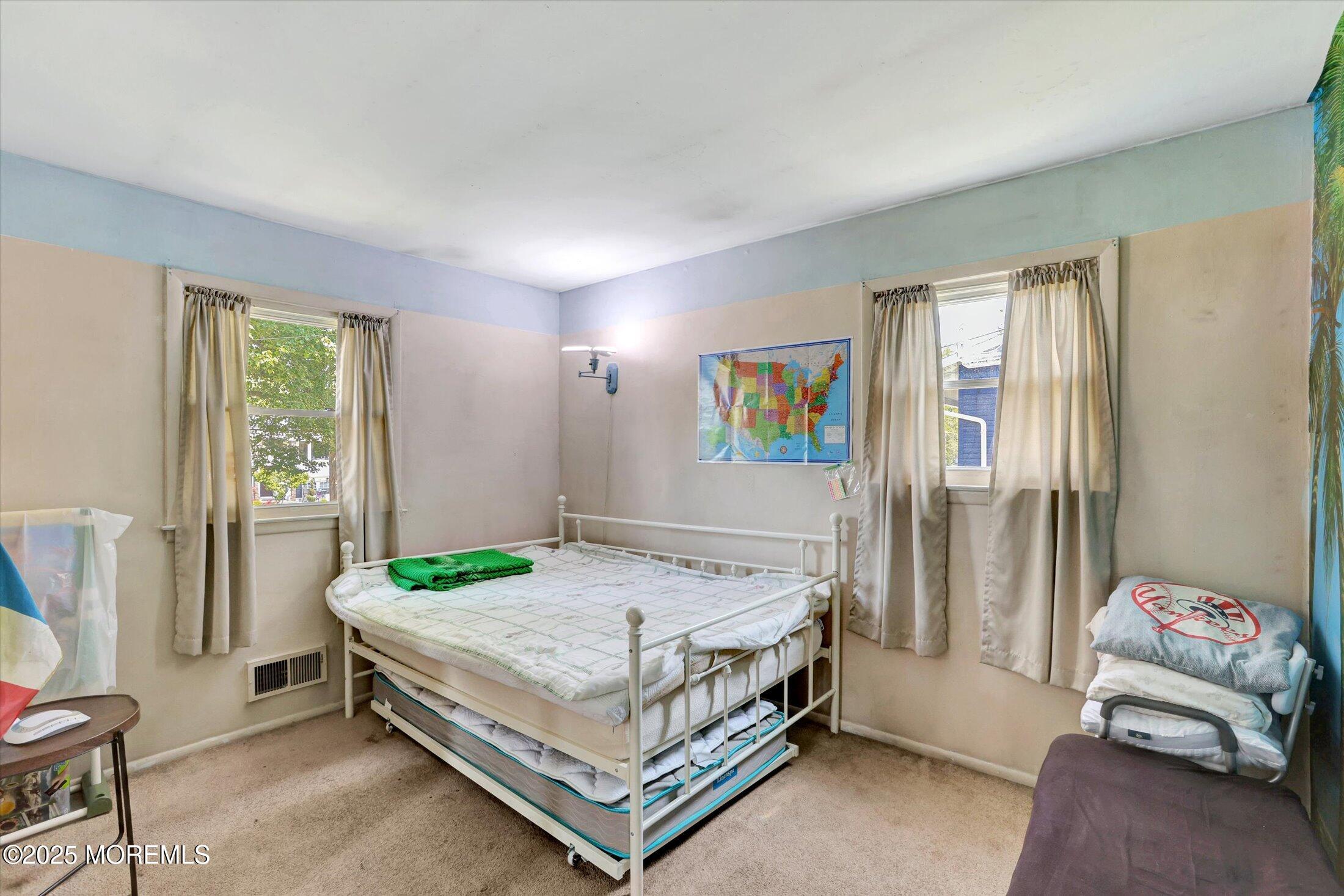 12 Steven Place Jackson, NJ 08527 - Photo 20 of 31 a bedroom with a bed and a couch