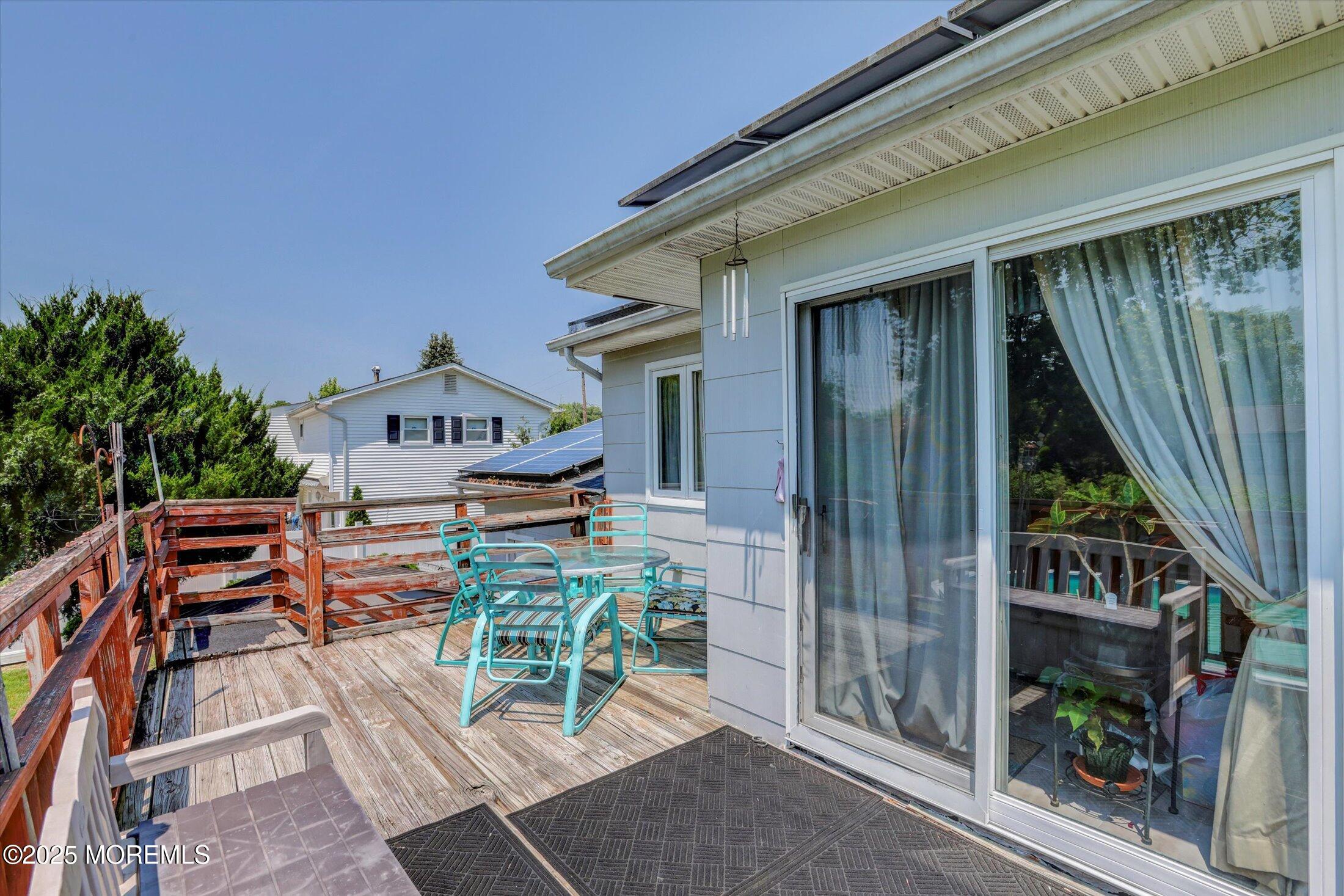 12 Steven Place Jackson, NJ 08527 - Photo 23 of 31 a balcony with table and chairs