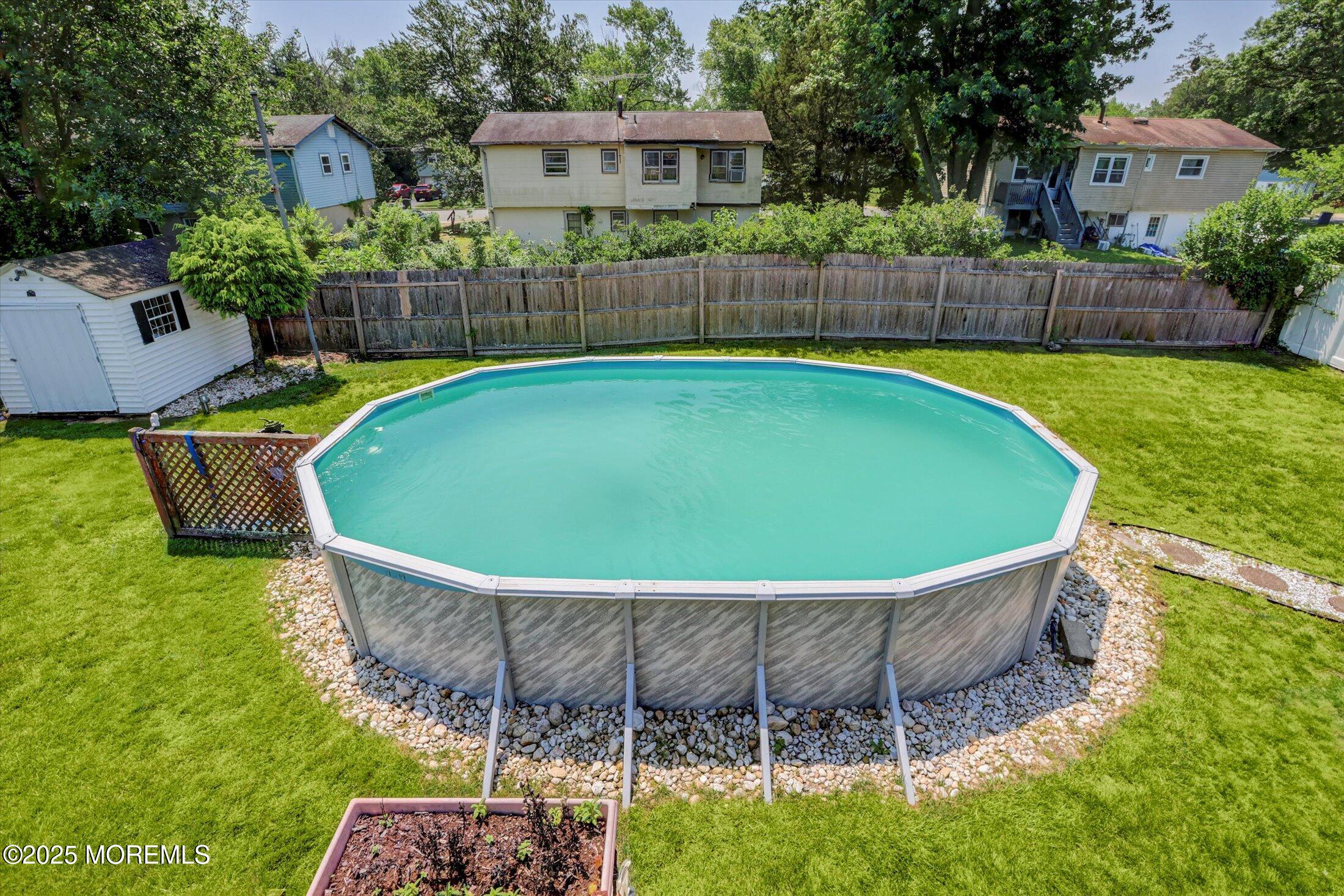 12 Steven Place Jackson, NJ 08527 - Photo 27 of 31 a view of a backyard with a tub and wooden fence