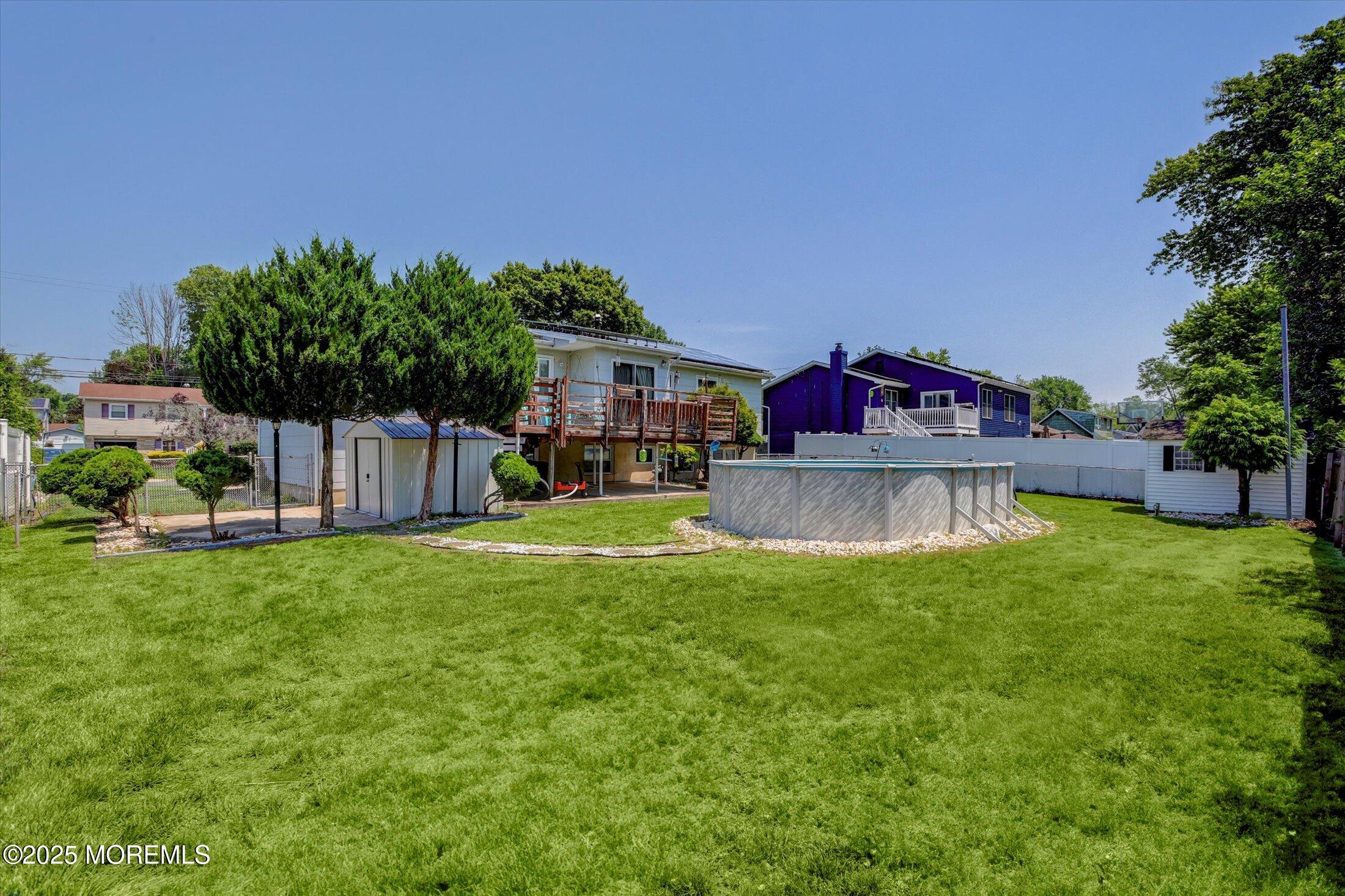 12 Steven Place Jackson, NJ 08527 - Photo 28 of 31 a view of a house with a yard and a garage