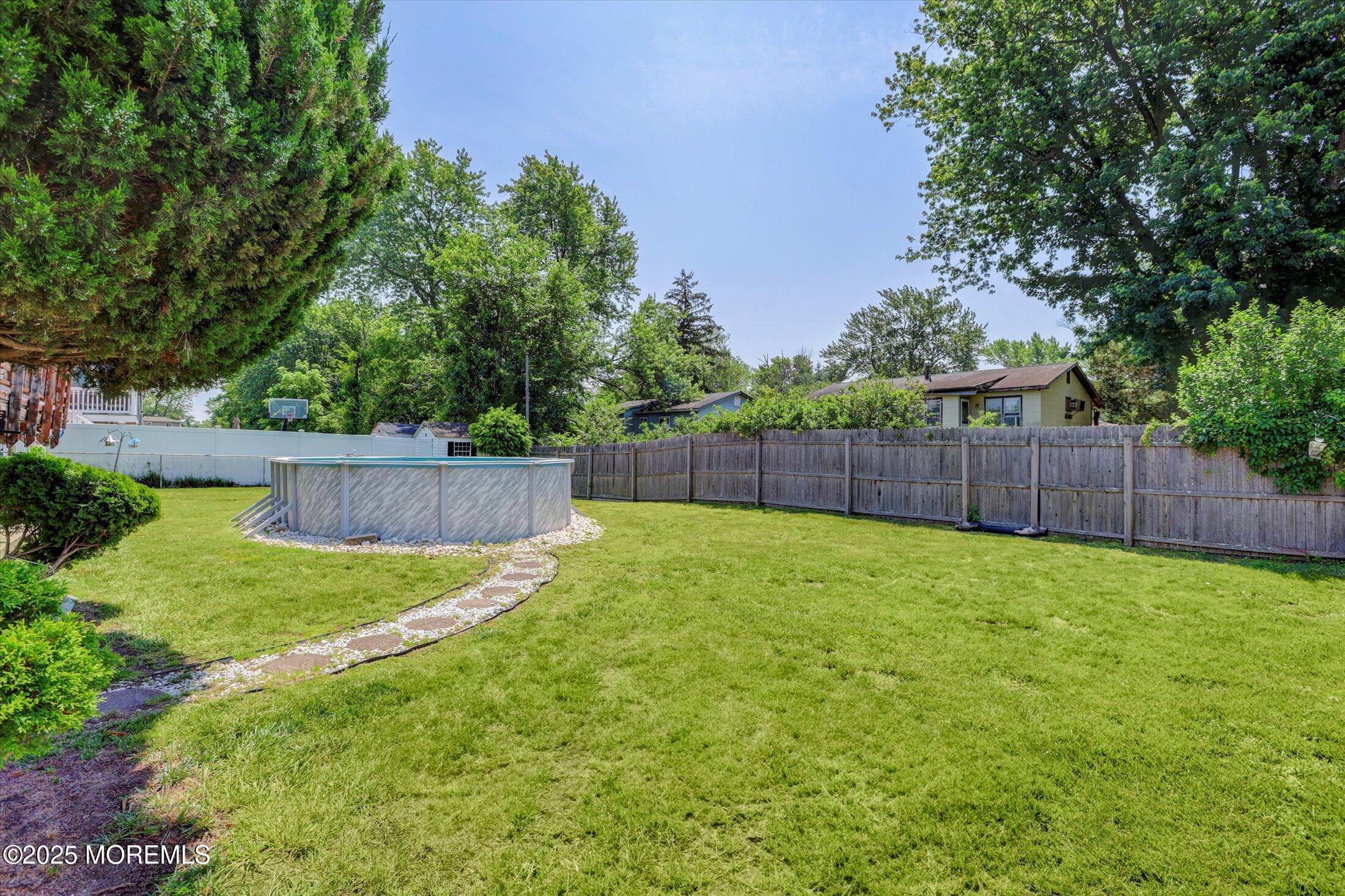 12 Steven Place Jackson, NJ 08527 - Photo 30 of 31 a view of a backyard with a garden and trees
