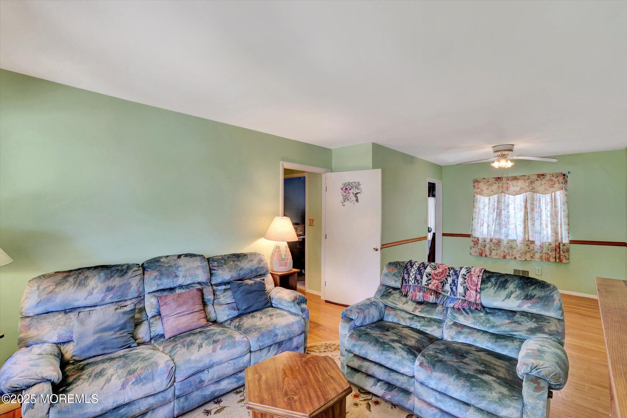 12 Steven Place Jackson, NJ 08527 - Photo 3 of 31 a living room with furniture and a wooden floor