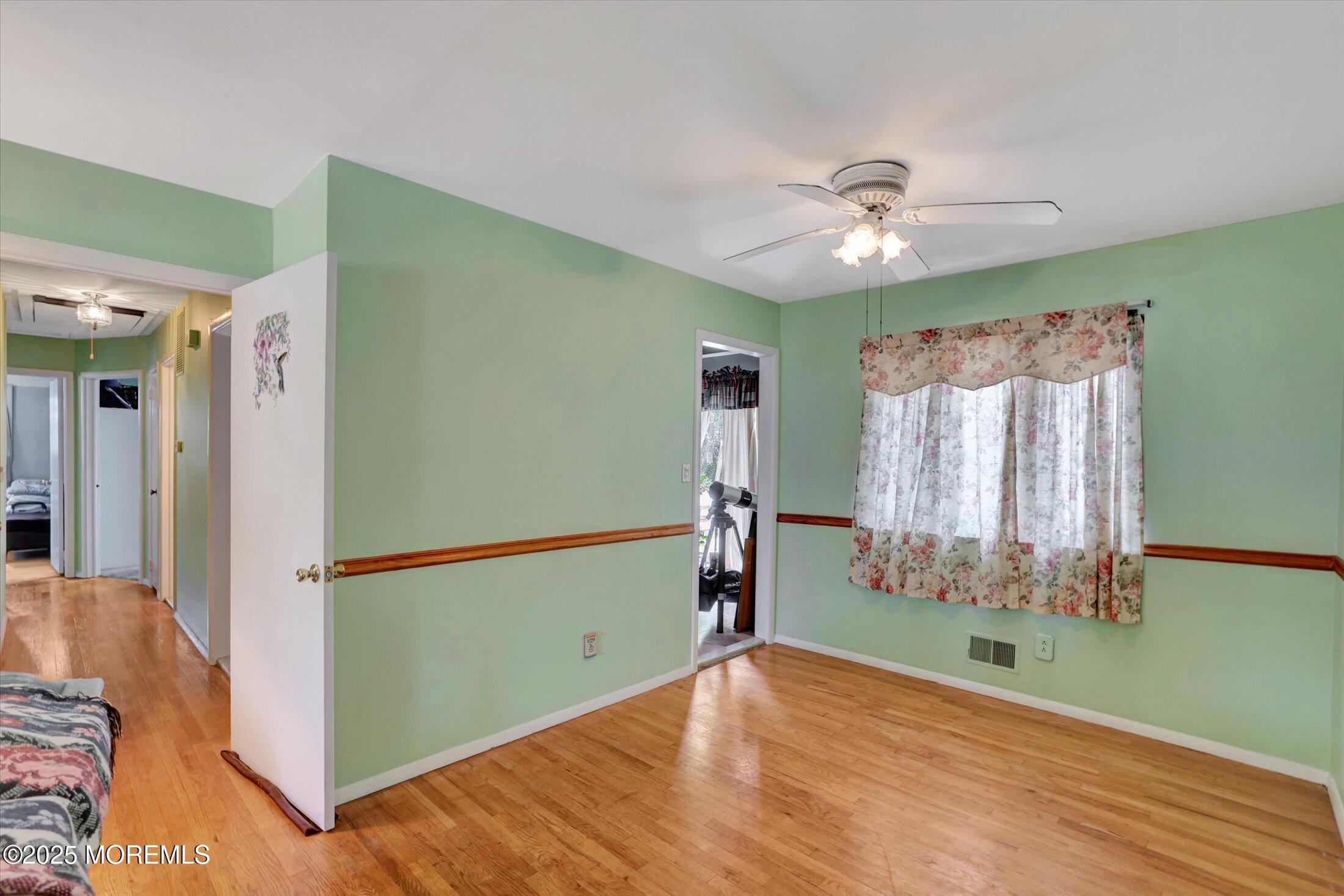 12 Steven Place Jackson, NJ 08527 - Photo 6 of 31 a view of room with window ceiling fan and hardwood floor