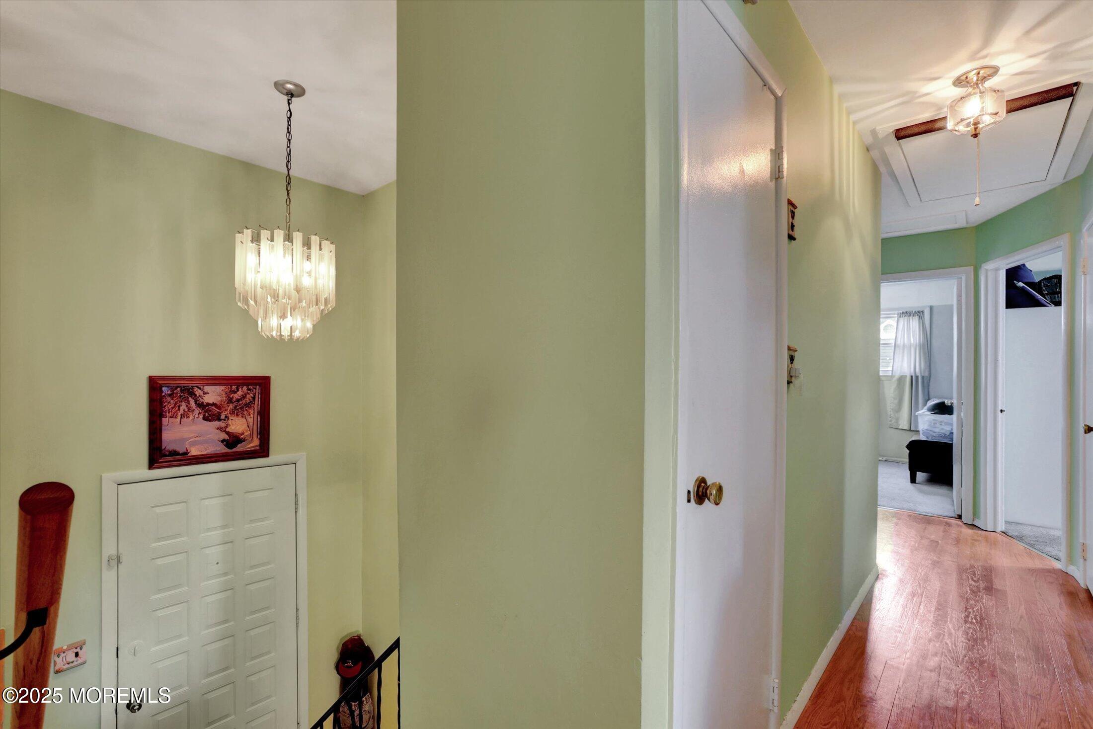 12 Steven Place Jackson, NJ 08527 - Photo 8 of 31 a view of a hallway with chandelier and entryway