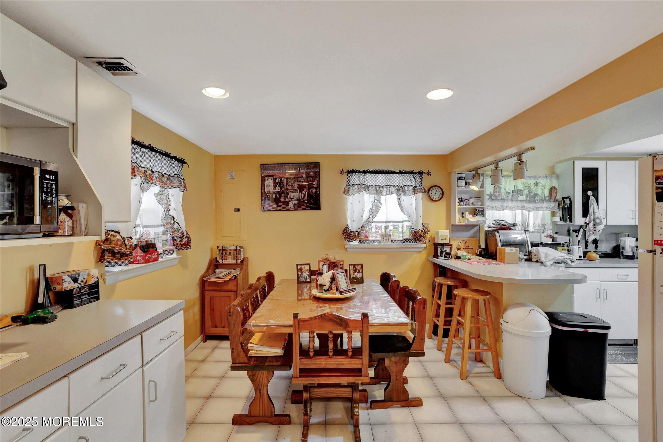 12 Steven Place Jackson, NJ 08527 - Photo 10 of 31 a view of a dining room with furniture and a kitchen