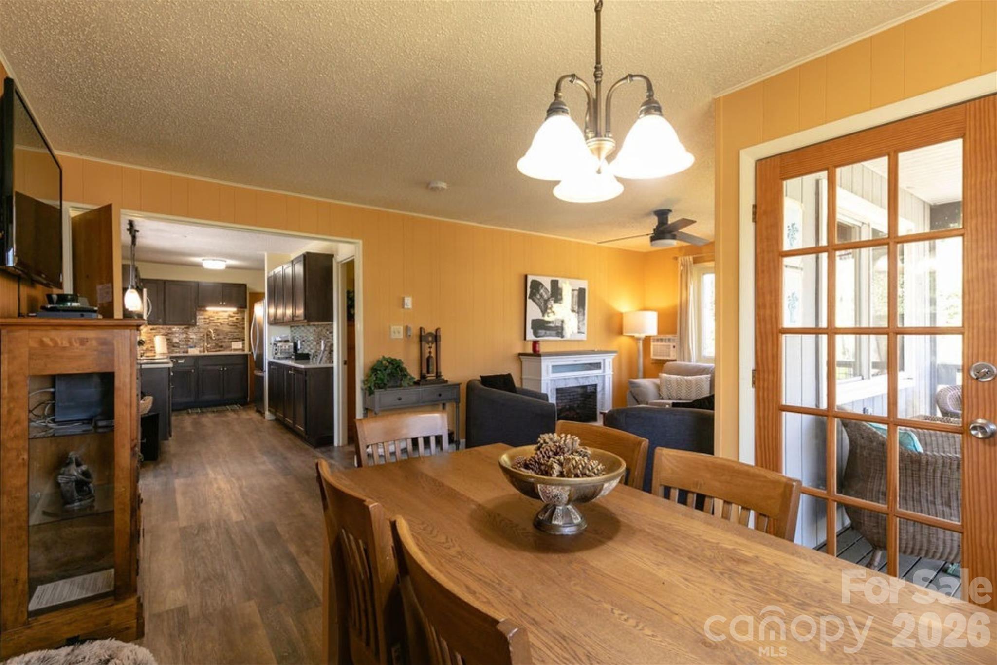 7 North Delano Road Asheville, NC 28805 - Photo 11 of 32 a living room with couches a dining table and chairs with outer view