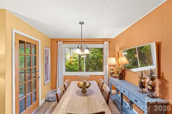 a room with furniture and large windows