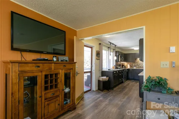 a view of living room with furniture and flat screen tv