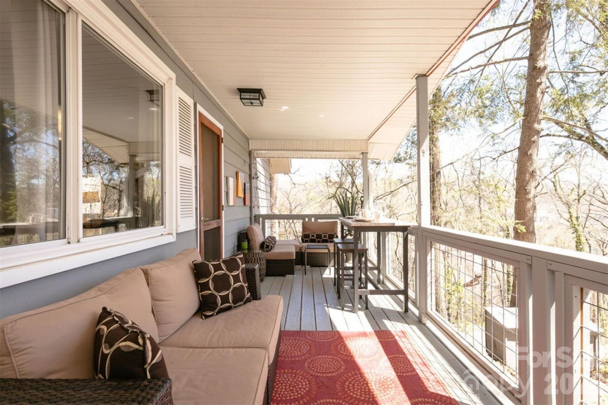 7 North Delano Road Asheville, NC 28805 - Photo 2 of 32 a living room with large windows