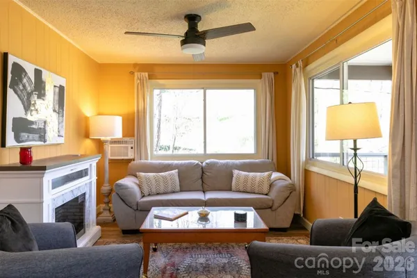 a living room with furniture and a large window