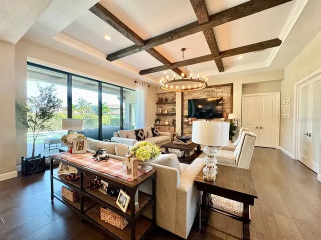 a dining room with furniture window and wooden floor