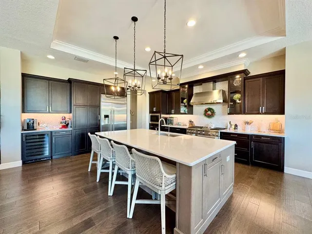 a bedroom with bed and a chandelier
