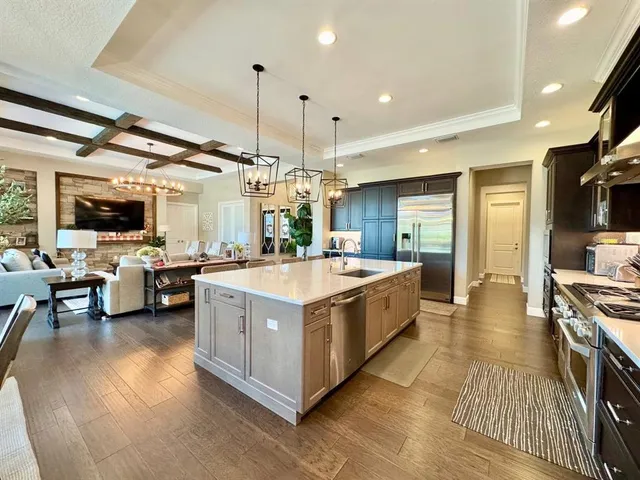 a spacious bathroom with a granite countertop sink toilet and shower