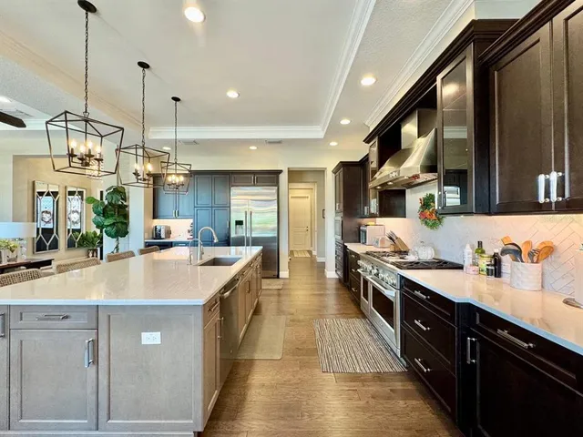 a en suite bathroom with a double vanity sink and a mirror