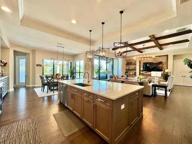 a bathroom with a granite countertop sink a toilet and shower