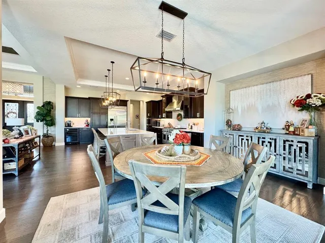 a view of a livingroom with workspace and a window