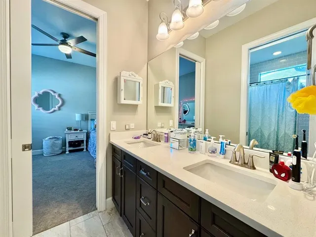 a spacious bathroom with a tub sink shower and mirror