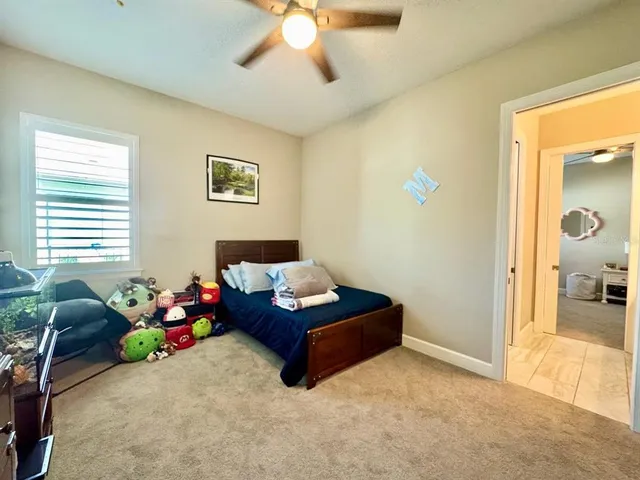 a view of a house with porch and garden