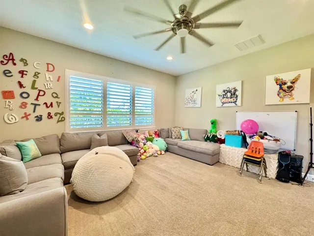 a view of a patio with dining table and chairs with a barbeque grill table and chairs