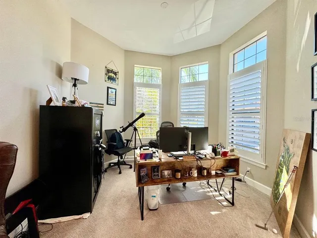 a view of a dining room with furniture window and outside view