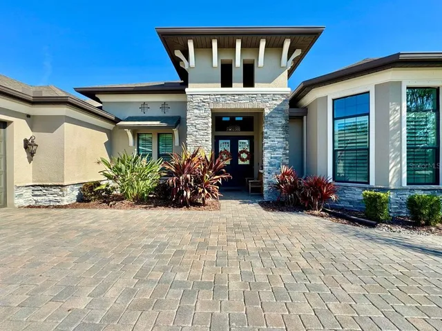 a living room with furniture and flat screen tv