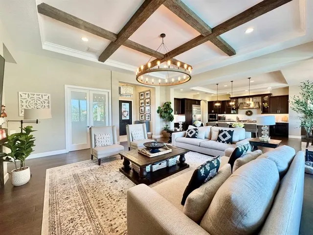 a large kitchen with a table and chairs