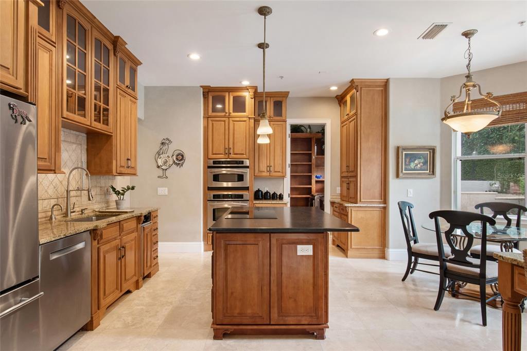 248 Maison Court Altamonte Springs, FL 32714 - Photo 12 of 47 a kitchen with stainless steel appliances granite countertop a stove and a refrigerator