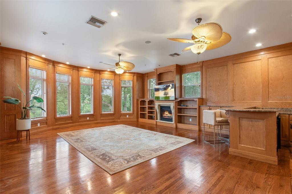 248 Maison Court Altamonte Springs, FL 32714 - Photo 33 of 47 a living room with kitchen view and wooden floor