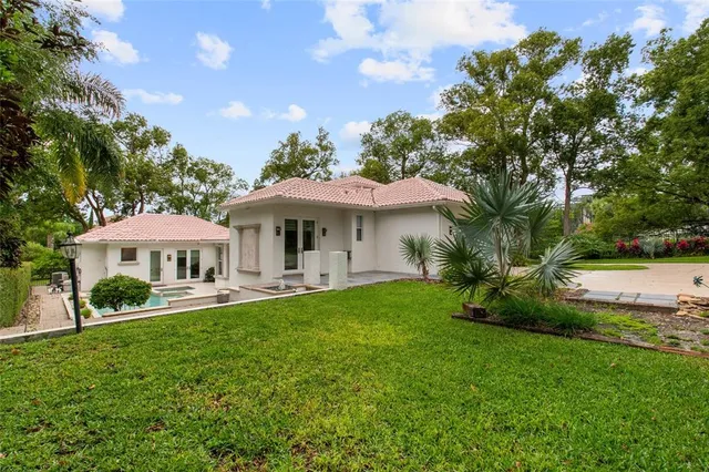 a view of a house with a yard porch and sitting area