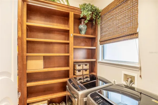 a kitchen with stainless steel appliances a refrigerator and a stove
