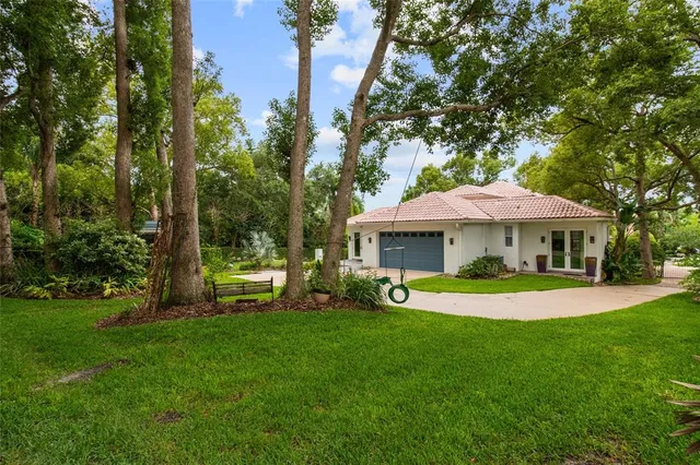 a view of a house with a yard porch and sitting area