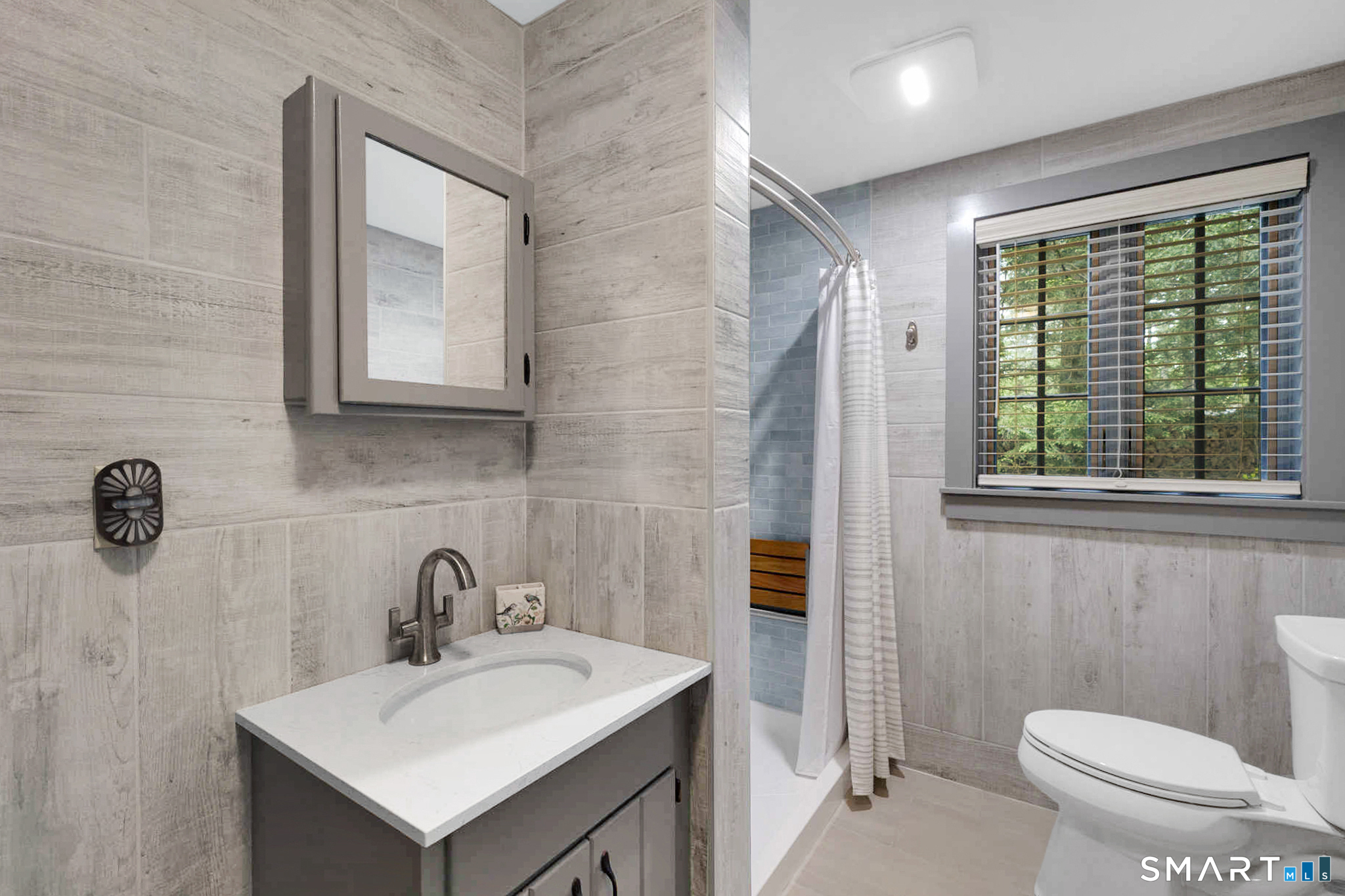 47 Pinehurst Road Hartland, CT 06091 - Photo 23 of 39 a bathroom with a toilet sink and mirror