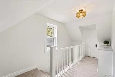 a view of a hallway with a window