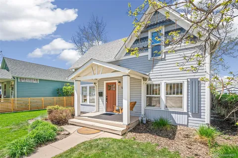 a view of a house with a yard and plants