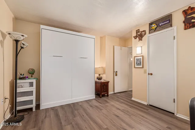 a view of a chairs and table in patio