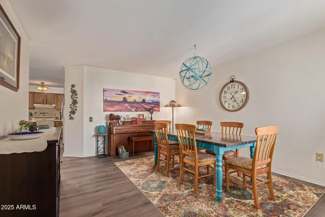 a living room with furniture ceiling fan and a window