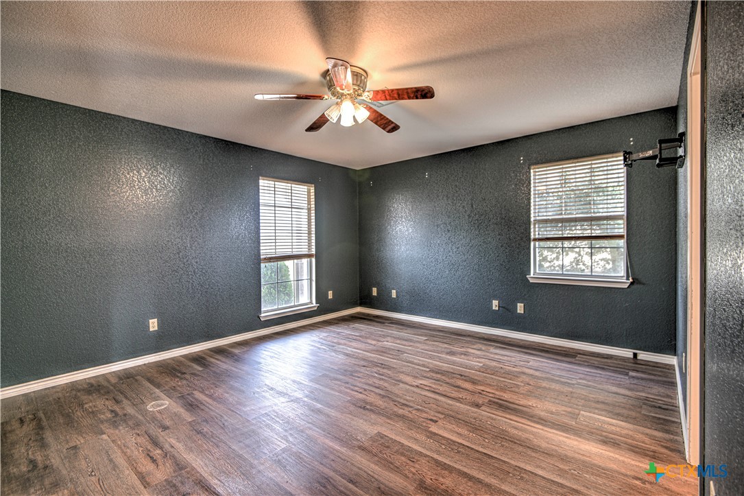 809 Hudson Lane Eddy, TX 76524 - Photo 19 of 48 wooden floor in an empty room with a window