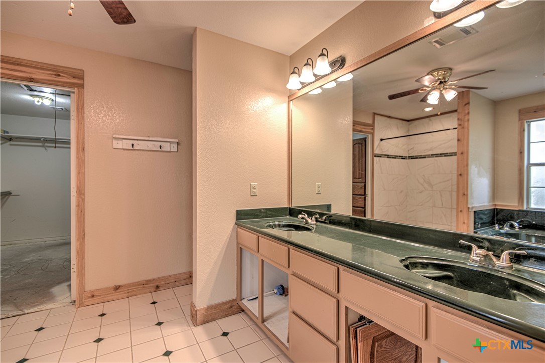 809 Hudson Lane Eddy, TX 76524 - Photo 21 of 48 a kitchen with stainless steel appliances granite countertop a sink stove and refrigerator