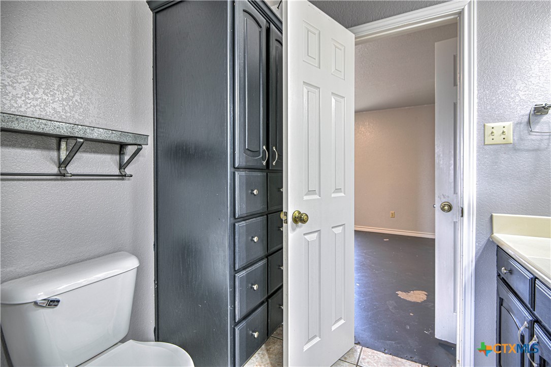 809 Hudson Lane Eddy, TX 76524 - Photo 28 of 48 a bathroom with a toilet and a shower