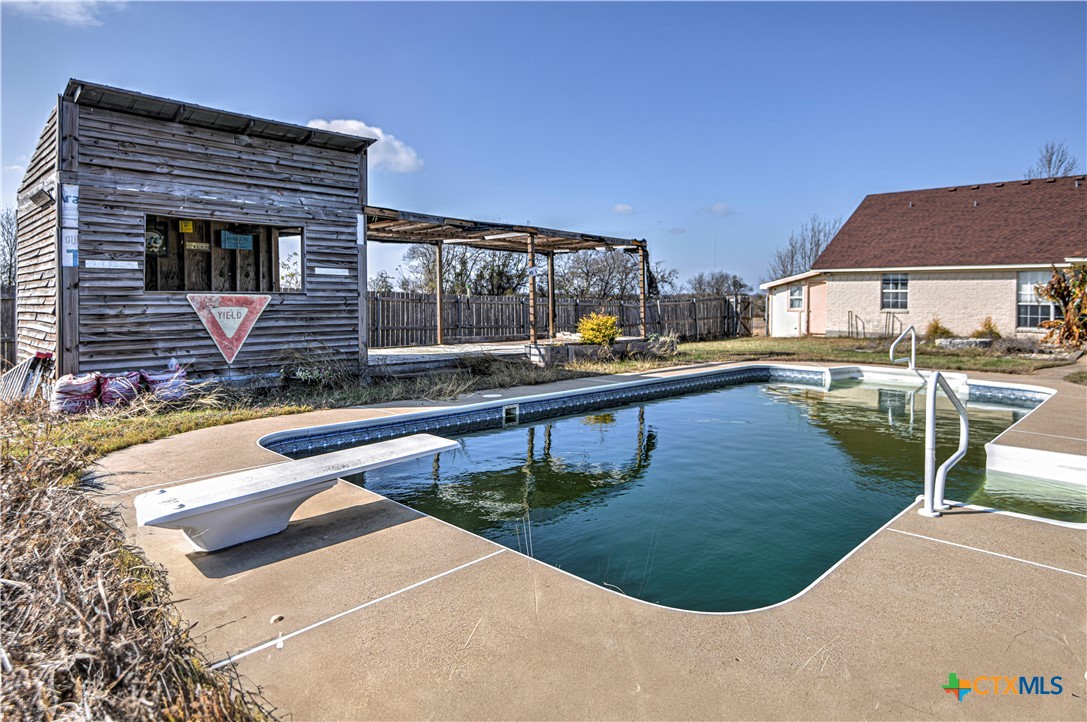 809 Hudson Lane Eddy, TX 76524 - Photo 40 of 48 a swimming pool with outdoor seating