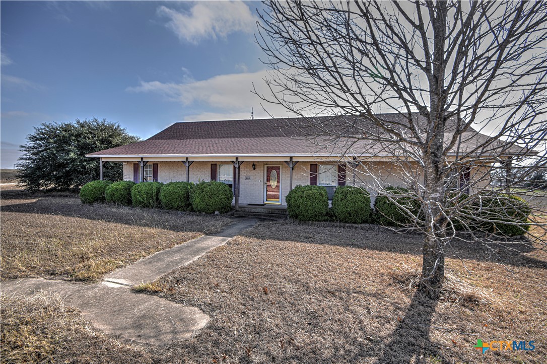 809 Hudson Lane Eddy, TX 76524 - Photo 4 of 48 a front view of a house with a yard and garage