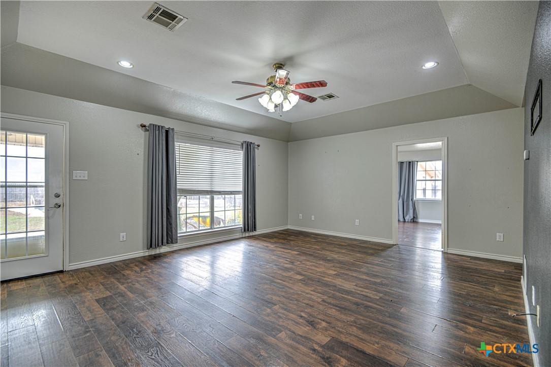 809 Hudson Lane Eddy, TX 76524 - Photo 7 of 48 a view of an empty room with wooden floor and a window