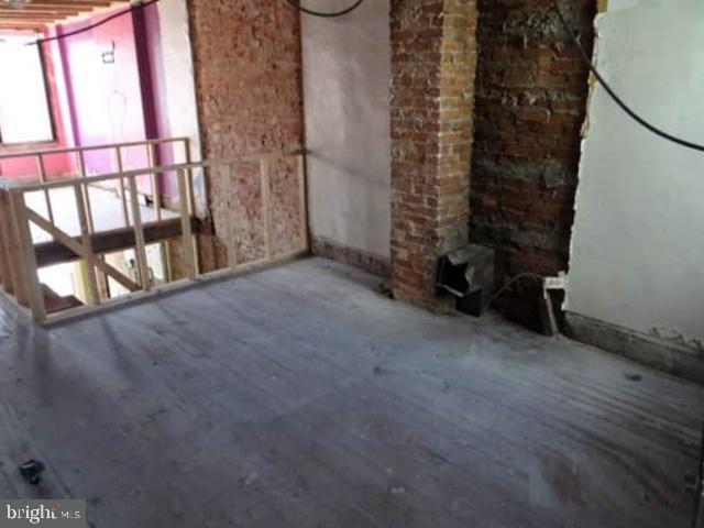 1720 North Payson Street Baltimore, MD 21217 - Photo 4 of 9 an empty room with windows