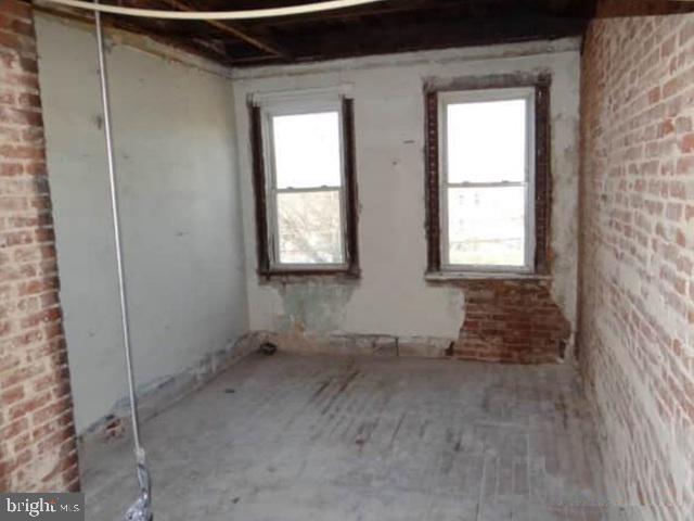 1720 North Payson Street Baltimore, MD 21217 - Photo 6 of 9 a view of an empty room with a window