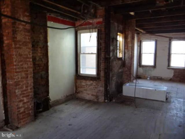 1720 North Payson Street Baltimore, MD 21217 - Photo 9 of 9 a view of an empty room and a window