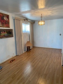 3029 West 83rd Place Chicago, IL 60652 - Photo 3 of 10 a view of empty room with wooden floor