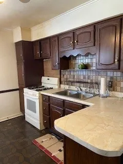 a kitchen with a sink and cabinets